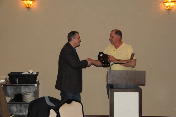 Jim Westerman accepts Past President Award from Dale Raisleger
